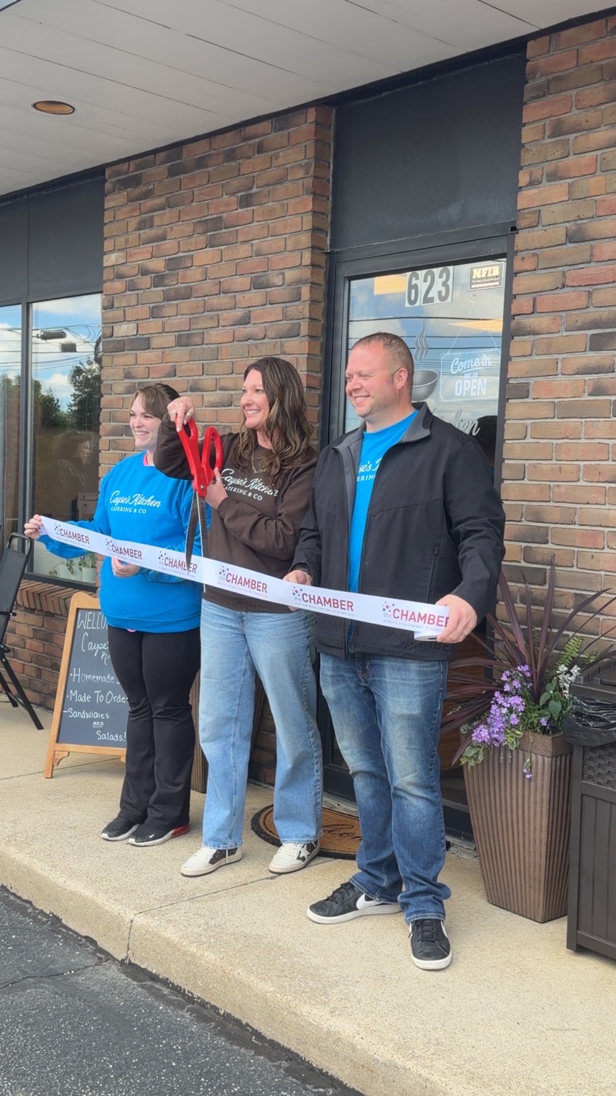 Cayse Brown ribbon cutting grand opening